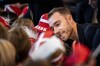 Denmark's Christian Eriksen signs autographs for elementary school children during an event to send the national soccer team off on their journey to the World Cup in Qatar, from the Vilhelm Lauritzen Terminal in Copenhagen, Denmark, Tuesday, Nov. 15, 2022. (Ida Marie Odgaard/Ritzau Scanpix via AP)