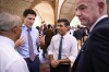Canadian Prime Minister Justin Trudeau, second left, Britain's Prime Minister Rishi Sunak, second right, and FIFA President Gianni Infantino, right, chat ahead of a working lunch at the G20 Summit, Tuesday, Nov. 15, 2022 in Nusa Dua, Bali, Indonesia. (Leon Neal/Pool Photo via AP)