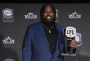 Most outstanding offensive lineman, Stanley Bryant of the Winnipeg Blue Bombers, holds up his trophy during the CFL Awards in Regina, Thursday, Nov. 17, 2022. THE CANADIAN PRESS/Paul Chiasson