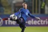 FILE - England goalkeeper Aaron Ramsdale kicks the ball during the warm-up before the World Cup 2022 group I qualifying soccer match between San Marino and England at Olympic Stadium, in Serravalle, San Marino, Monday, Nov. 15, 2021. With beer sales banned at World Cup stadiums in Qatar, on Friday Nov. 18, 2022, Ramsdale said that “Hopefully with them not being able to drink, we can perform on the pitch to give them that sort of excitement and buzz”. (AP Photo/Antonio Calanni, File)