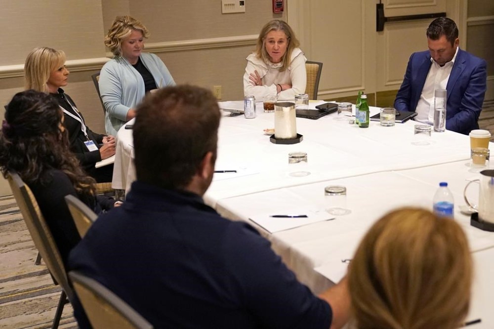 LPGA Commissioner Mollie Marcoux Samaan, second from right, speaks during a media roundtable at the LPGA CME Group Tour Championship golf tournament, Friday, Nov. 18, 2022, at the Tiburón Golf Club in Naples, Fla. More than $100 million will be awarded to LPGA players for the first time in 2023. That's an increase of about 18% over what was planned for this season and more than doubling what was paid out on the tour just a decade ago. (AP Photo/Lynne Sladky)