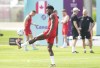 Canada defender Alphonso Davies kicks the ball during practice ahead of the World Cup in Doha, Qatar on Saturday, November 19, 2022. THE CANADIAN PRESS/Nathan Denette