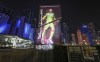 A giant FIFA World Cup advertisement on a skyscraper shows Germany's goalkeeper Manuel Neuer, reading 