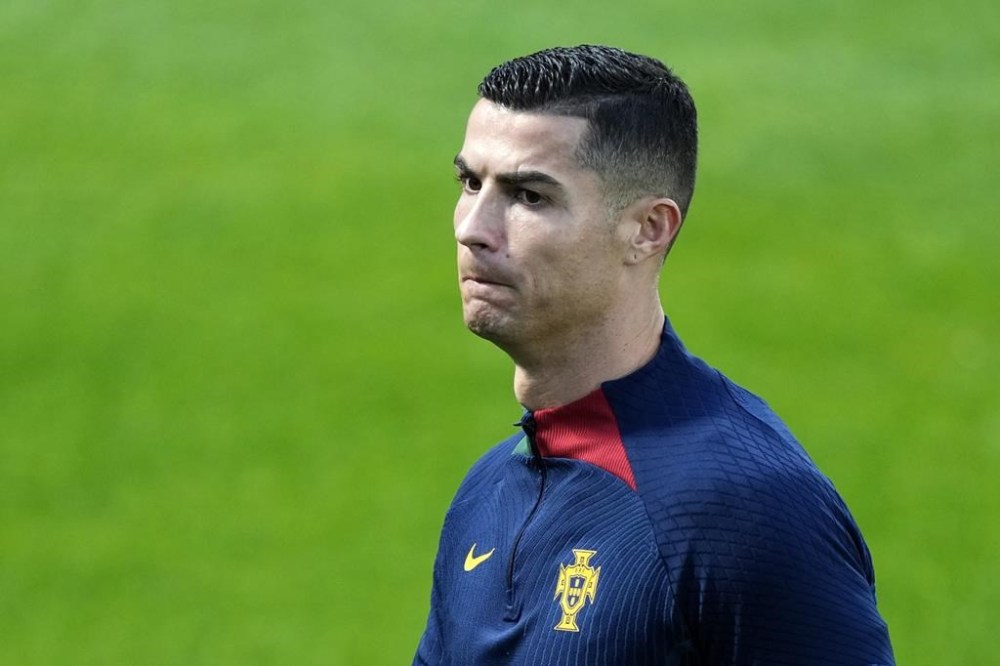 Cristiano Ronaldo walks on the pitch during a Portugal soccer team training in Oeiras, outside Lisbon, Monday, Nov. 14, 2022. Portugal will play Nigeria Thursday in a friendly match in Lisbon before departing to Qatar on Friday for the World Cup. (AP Photo/Armando Franca)