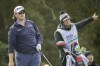 Harry Higgs, left, watches his drive off the second tee land in the rough of the fairway during the third round of the RSM Classic golf tournament, Saturday, Nov. 19, 2022, in St. Simons Island, Ga. (AP Photo/Stephen B. Morton)