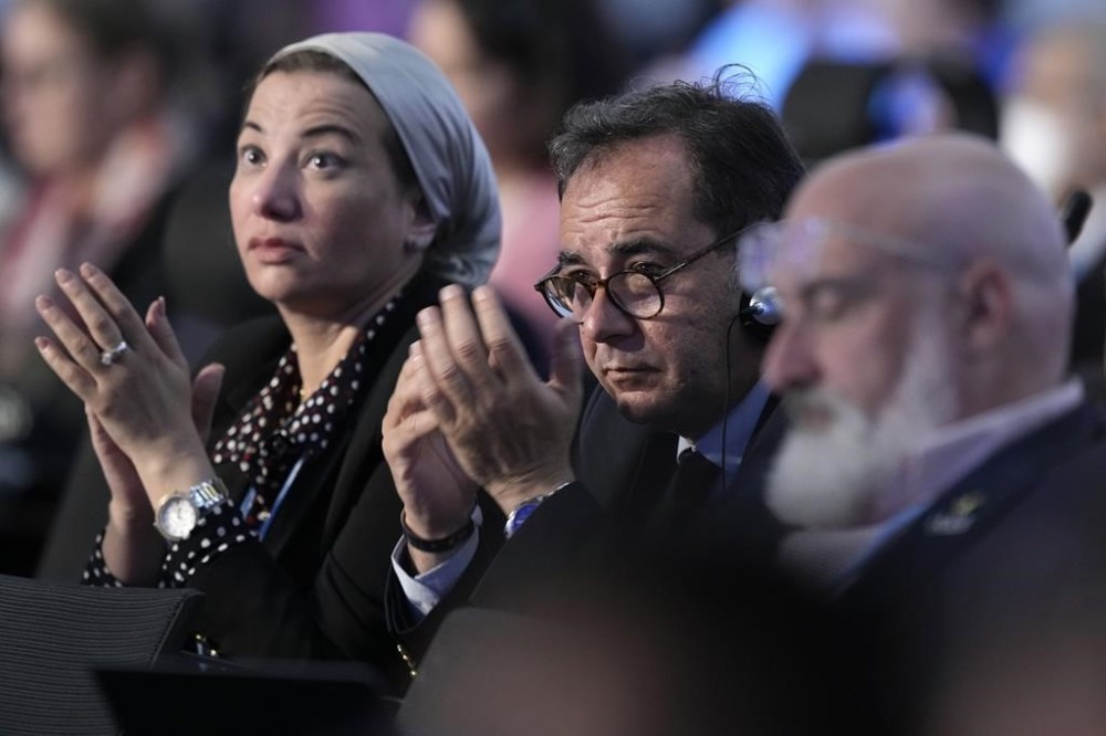 Delegates listen during a closing plenary session at the COP27 U.N. Climate Summit, Sunday, Nov. 20, 2022, in Sharm el-Sheikh, Egypt. (AP Photo/Peter Dejong)