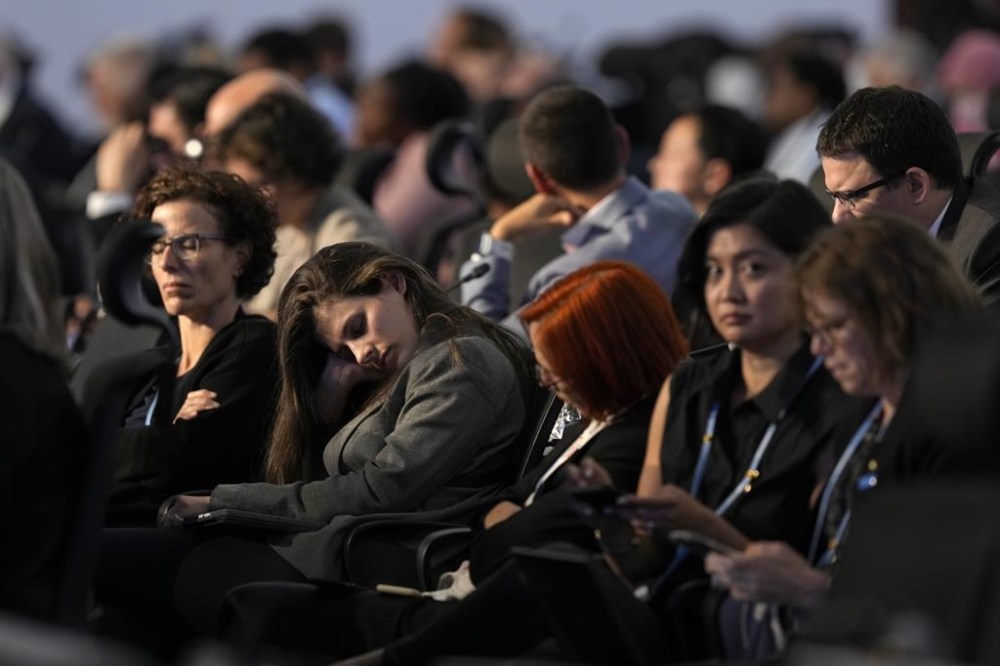 Delegates nap during a closing plenary session at the COP27 U.N. Climate Summit, Sunday, Nov. 20, 2022, in Sharm el-Sheikh, Egypt. (AP Photo/Peter Dejong)