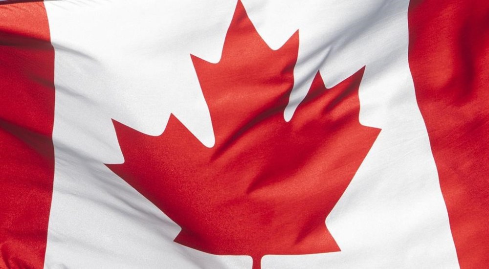 The Canadian flag is seen on a flag pole in Ottawa on June 30, 2020. After months of imploring the federal government to clean up their sport, Canadian gymnasts will finally have the floor in Ottawa. THE CANADIAN PRESS/Adrian Wyld