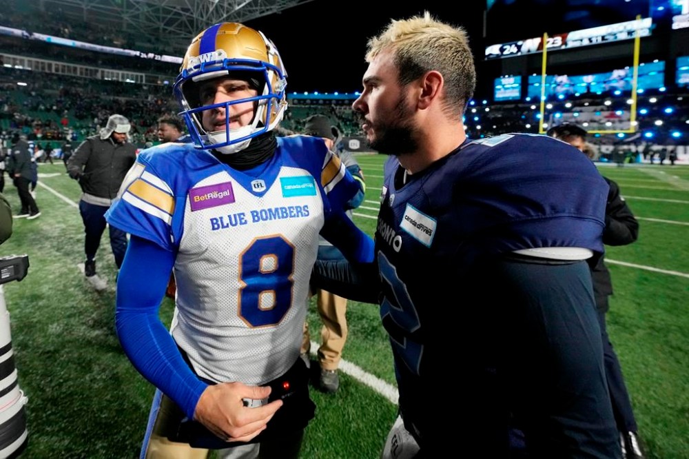 Toronto Argonauts quarterback Chad Kelly (12) and Winnipeg Blue Bombers quarterback Zach Collaros (8) shake hands after the Argonauts defeated the Blue Bombers in the 109th Grey Cup at Mosaic Stadium in Regina, Sunday, Nov. 20, 2022. Collaros made no excuses after the Toronto Argonauts upset the two-time defending Grey Cup champion Winnipeg Blue Bombers 24-23 Sunday in the CFL title game. THE CANADIAN PRESS/Frank Gunn
