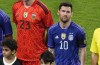 Argentina's Lionel Messi, left, listens to the United Arab Emirates national anthem, during a friendly soccer match between Argentina and United Arab Emirates, at Mohammed Bin Zayed Stadium, in Abu Dhabi, Wednesday, Nov. 16, 2022. (AP Photo/Hussein Malla)
