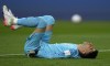 Iran's goalkeeper Alireza Beiranvand reacts after sustaining an injury during the World Cup group B soccer match between England and Iran at the Khalifa International Stadium in Doha, Qatar, Monday, Nov. 21, 2022. (AP Photo/Frank Augstein)