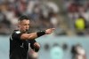 Referee Raphael Claus gives directions during the World Cup group B soccer match between England and Iran at the Khalifa International Stadium in Doha, Qatar, Monday, Nov. 21, 2022. (AP Photo/Frank Augstein)