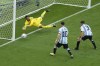 Saudi Arabia's goalkeeper Mohammed Al-Owais, left, dives to make a save during the World Cup group C soccer match between Argentina and Saudi Arabia at the Lusail Stadium in Lusail, Qatar, Tuesday, Nov. 22, 2022. (AP Photo/Luca Bruno)