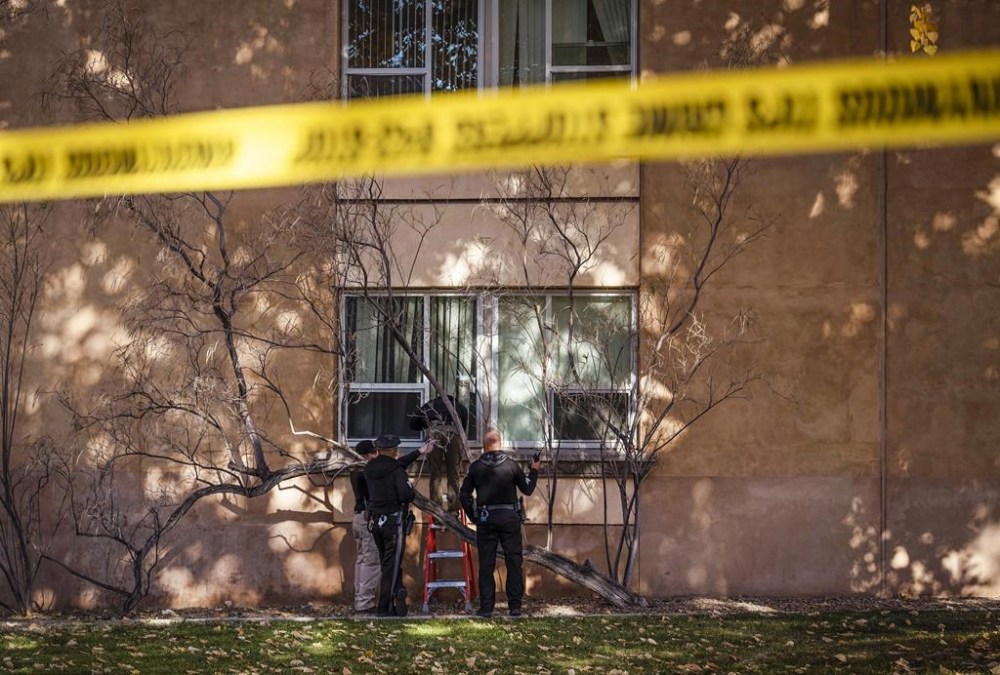 Law enforcement continue their investigation of a deadly overnight shooting at Coronado Hall on the campus of the University of New Mexico in Albuquerque, N.M., on Saturday, Nov. 19, 2022. (Chancey Bush/Albuquerque Journal)/The Albuquerque Journal via AP)