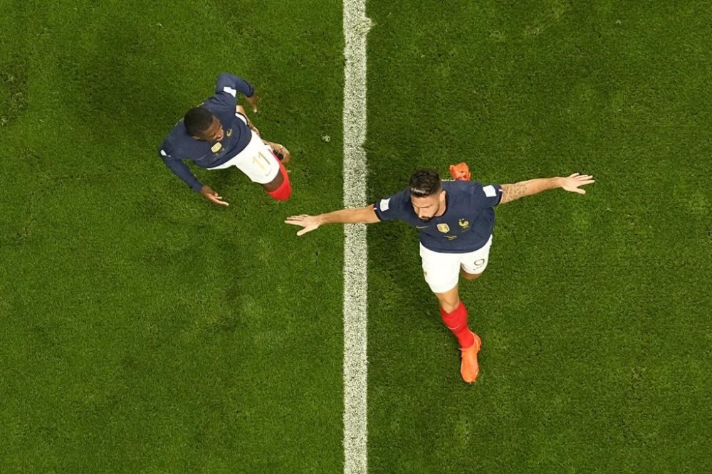 France's Olivier Giroud, right, celebrates after scoring his side's second goal during the World Cup group D soccer match between France and Australia, at the Al Janoub Stadium in Al Wakrah, Qatar, Tuesday, Nov. 22, 2022. (AP Photo/Pavel Golovkin)