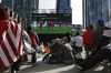 A couple kiss under the big screen as they watch the U.S. vs Wales World Cup Soccer game at The Crossing during a World Cup watch event on Monday, Nov. 21, 2022 in San Francisco. (Lea Suzuki/San Francisco Chronicle via AP)