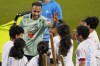 Brazil's Neymar greets children from a FIFA social project after a training session at the Grand Hamad stadium in Doha, Qatar, Sunday, Nov. 20, 2022. Brazil will play their first match in the World Cup against Serbia on Nov. 24. (AP Photo/Andre Penner)