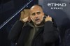 Manchester City's head coach Pep Guardiola sits on the bench prior to the start of the English League Cup third round soccer match between Manchester City and Chelsea at Etihad Stadium in Manchester, England, Wednesday, Nov. 9, 2022. (AP photo/Dave Thompson)