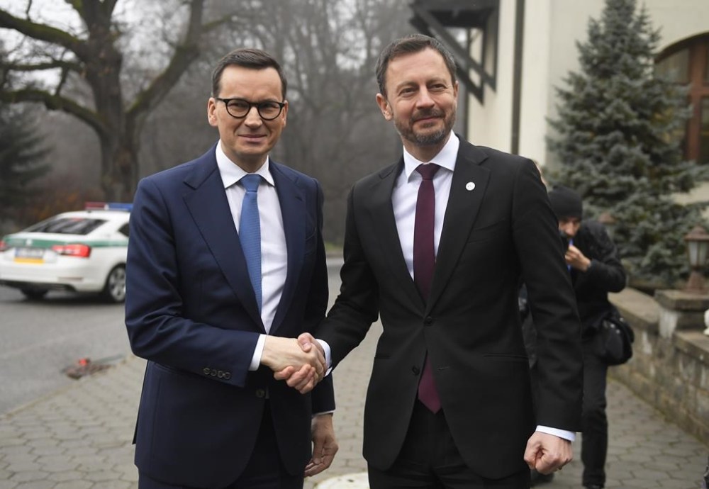 Slovakia's Prime Minister Eduard Heger, right, Poland's Prime Minister Mateusz Morawiecki prior to the summit summit of Visegrad Group (V4) prime ministers in Kosice, Slovakia, Thursday Nov. 24, 2022. The leaders of the Visegrad Four group of Central European countries will discuss the current situation in Europe in the wake of the Russian aggression in Ukraine and the energy crisis. (Frantisek Ivan/TASR via AP)