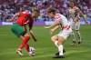 Croatia's Borna Sosa, centre, and Morocco's Hakim Ziyech challenge for the ball during the World Cup group F soccer match between Morocco and Croatia at the Al Bayt Stadium in Al Khor, Qatar, Wednesday, Nov. 23, 2022. THE CANADIAN PRESS/AP-Aijaz Rahi