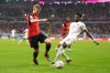 Canada forward Alphonso Davies (19) plays the ball in front of Belgium midfielder Kevin De Bruyne (7) during second half Group F World Cup soccer action at Ahmad bin Ali Stadium in Al Rayyan, Qatar, on Wednesday, Nov. 23, 2022. THE CANADIAN PRESS/Nathan Denette