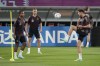 Germany's Leon Goretzka, right, kicks the ball to Serge Gnabry, left, Joshua Kimmich, background during a training session at the Al-Shamal stadium on the eve of the group E World Cup soccer match between Germany and Spain, in Al-Ruwais, Qatar, Friday, Nov. 25, 2022. Germany will play the second match against Spain on Sunday, Nov. 27. (AP Photo/Matthias Schrader)