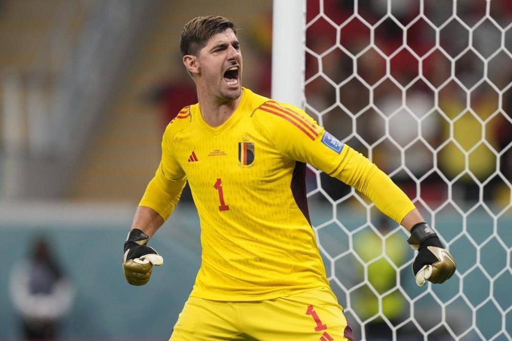 Belgium's goalkeeper Thibaut Courtois celebrates after he saved a penalty kick during the World Cup group F soccer match between Belgium and Canada, at the Ahmad Bin Ali Stadium in Doha, Qatar, Wednesday, Nov. 23, 2022. (AP Photo/Darko Bandic)