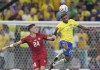 Serbia's Ivan Ilic, left, challenges for the ball with Brazil's Rodrygo during the World Cup group G soccer match between Brazil and Serbia, at the Lusail Stadium in Lusail, Qatar, Thursday, Nov. 24, 2022. (AP Photo/Natacha Pisarenko)
