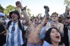 Argentina's soccer fans react at the end of their team's match against Mexico at the World Cup, hosted by Qatar, in Buenos Aires, Argentina, Saturday, Nov. 26, 2022. (AP Photo/Gustavo Garello)