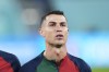 Portugal's Cristiano Ronaldo reacts while listening to the Portugal's national anthem prior the start of the World Cup group H soccer match between Portugal and Ghana at the Stadium 974 in Doha, Qatar, Thursday, Nov. 24, 2022. (AP Photo/Manu Fernandez)
