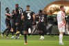 Canada forward Alphonso Davies, left, celebrates his goal against Croatia with teammates during first half group F World Cup soccer action at the Khalifa International Stadium in Al Rayyan, Qatar on Sunday, November 27, 2022. THE CANADIAN PRESS/Nathan Denette