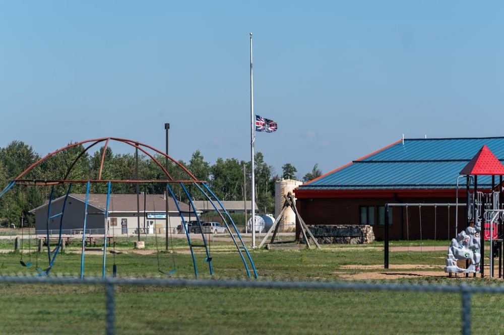 A flag flies at half mast in James Smith Cree Nation, Sask., Tuesday, Sept. 6, 2022. THE CANADIAN PRESS/Heywood Yu