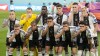German's team covers their mouth during the team photo prior to the World Cup group E soccer match between Germany and Japan, at the Khalifa International Stadium in Doha, Qatar, Wednesday, Nov. 23, 2022. (AP Photo/Matthias Schrader)