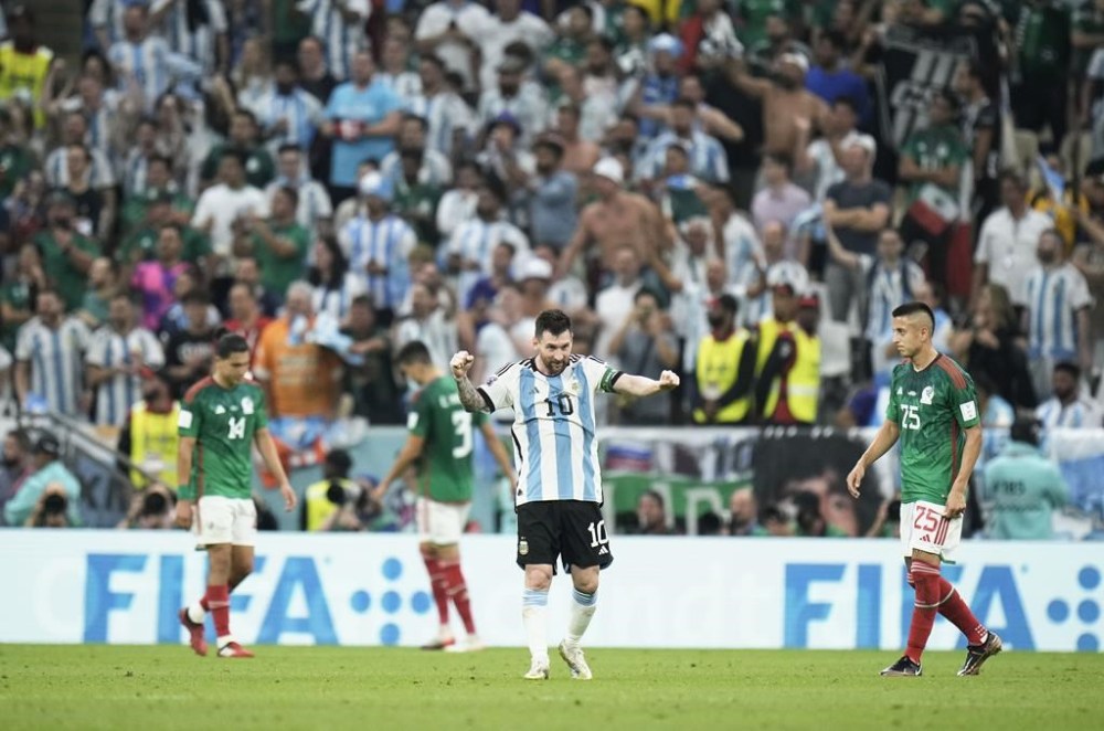 Argentina's Lionel Messi celebrates after his team won the World Cup group C soccer match between Argentina and Mexico, at the Lusail Stadium in Lusail, Qatar, Saturday, Nov. 26, 2022. (AP Photo/Hassan Ammar)
