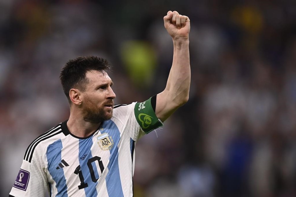 Argentina's Lionel Messi celebrates after scoring his side's opening goal during the World Cup group C soccer match between Argentina and Mexico, at the Lusail Stadium in Lusail, Qatar, Saturday, Nov. 26, 2022. (Fabio Ferrari/LaPresse via AP)
