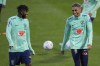 Brazil's Fred, left, and Rafinha laugh during a training session at the Continassa sporting center, in Turin, Italy, Monday, Nov. 14, 2022. Brazil will compete in Group G at the 2022 FIFA World Cup. (AP Photo/Luca Bruno)