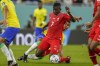 Switzerland's Breel Embolo, center, vies for the ball with Brazil's Casemiro during the World Cup group G soccer match between Brazil and Switzerland, at the Stadium 974 in Doha, Qatar, Monday, Nov. 28, 2022. (AP Photo/Andre Penner)
