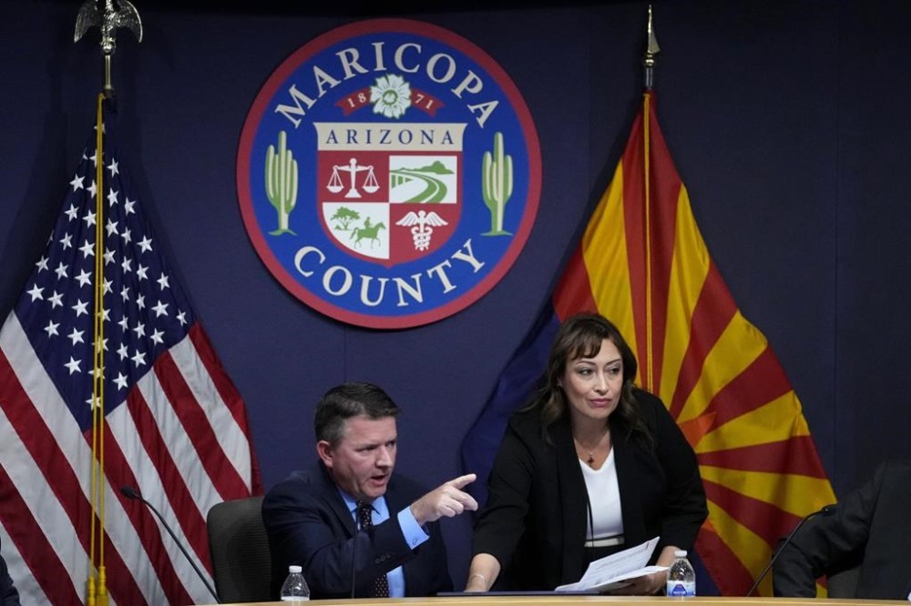 Maricopa County Board of Supervisors chairman Bill Gates calls for calm among the attendees during their general election canvass meeting, Monday, Nov. 28, 2022, in Phoenix. (AP Photo/Matt York)