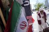 An Iranian flag and a scarf depicting U.S. flag are sold at the Souq Waqif Market in Doha, Qatar, Tuesday, Nov. 29, 2022. (AP Photo/Eugene Hoshiko)