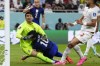 Christian Pulisic of the United States, center, collides with Iran's goalkeeper Alireza Beiranvand, left, after scoring his sides first goal during the World Cup group B soccer match between Iran and the United States at the Al Thumama Stadium in Doha, Qatar, Tuesday, Nov. 29, 2022. (AP Photo/Manu Fernandez)