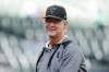 FILE - Then-Miami Marlins manager Don Mattingly smiles after throwing a ball to fans before a baseball game against the Milwaukee Brewers, Saturday, Oct. 1, 2022, in Milwaukee. Mattingly is joining the Toronto Blue Jays as bench coach to manager John Schneider, the team announced Wednesday, Nov. 30, 2022. (AP Photo/Jon Durr, File)