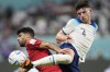 England's Declan Rice, right, kicks the ball past Iran's Mehdi Taremi during the World Cup group B soccer match between England and Iran at the Khalifa International Stadium in Doha, Qatar, Monday, Nov. 21, 2022. (AP Photo/Abbie Parr)