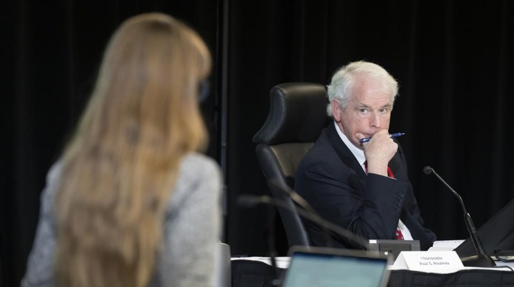 Commissioner Paul Rouleau listens to counsel question a witness at the Public Order Emergency Commission, in Ottawa, Friday, Nov. 4, 2022. Lawyers for