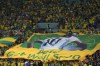 Brazilian fans hold a giant Brazilian flag with picture of former Brazilian player Pele with message reads in English 