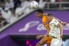 Qatar's Pedro Miguel, right, jumps for a header with Cody Gakpo of the Netherlands during the World Cup group A soccer match between the Netherlands and Qatar, at the Al Bayt Stadium in Al Khor , Qatar, Tuesday, Nov. 29, 2022. (AP Photo/Darko Bandic)