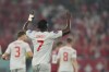 Switzerland's Breel Embolo celebrates after scoring his side's second goal during the World Cup group G soccer match between Serbia and Switzerland, at the Stadium 974 in Doha, Qatar, Friday, Dec. 2, 2022. (AP Photo/Martin Meissner)