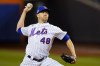 FILE - New York Mets starting pitcher Jacob deGrom delivers against the San Diego Padres during the first inning of Game 2 of a National League wild-card baseball playoff series Oct. 8, 2022, in New York. Free-agent ace deGrom and the Texas Rangers agreed to a five-year contract Friday, Dec. 2, 2022. (AP Photo/Frank Franklin II, File)