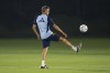 Spain's head coach Luis Enrique plays with a ball as his team prepares to work out during a training session at Qatar University, in Doha, Qatar, Friday, Dec. 2, 2022. Spain will play against Morocco in the round of 16 knockout round of the World Cup soccer tournament on Dec. 6. (AP Photo/Julio Cortez)