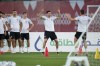 Poland's Robert Lewandowski, center, works out with teammates during a training session in Doha, Qatar, Saturday, Dec. 3, 2022. Poland will play against France in the round of 16 phase of the World Cup soccer tournament on Dec. 4. (AP Photo/Julio Cortez)