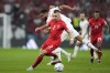 Canada's Alistair Johnston and Morocco's Sofiane Boufal challenge for the ball during the World Cup group F soccer match between Canada and Morocco at the Al Thumama Stadium in Doha , Qatar, Thursday, Dec. 1, 2022. THE CANADIAN PRESS/AP-Natacha Pisarenko